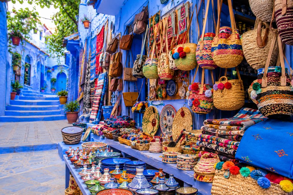 Traditional handicrafts market in Chefchaouen Morocco with colorful handmade baskets textiles and pottery